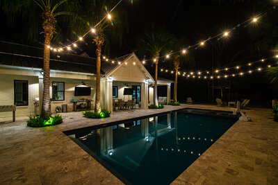 beautiful backyard landscape with bistro string lights